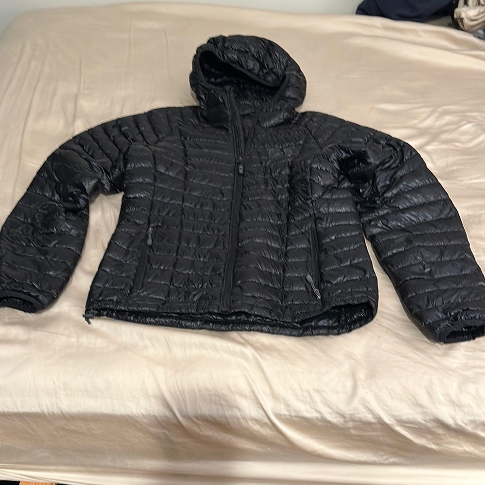 Small Black Puffer Ghost Whisperer Jacket with Hood by Mountain Hardwear.